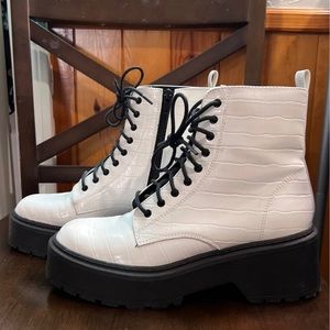 White combat boots with black laces